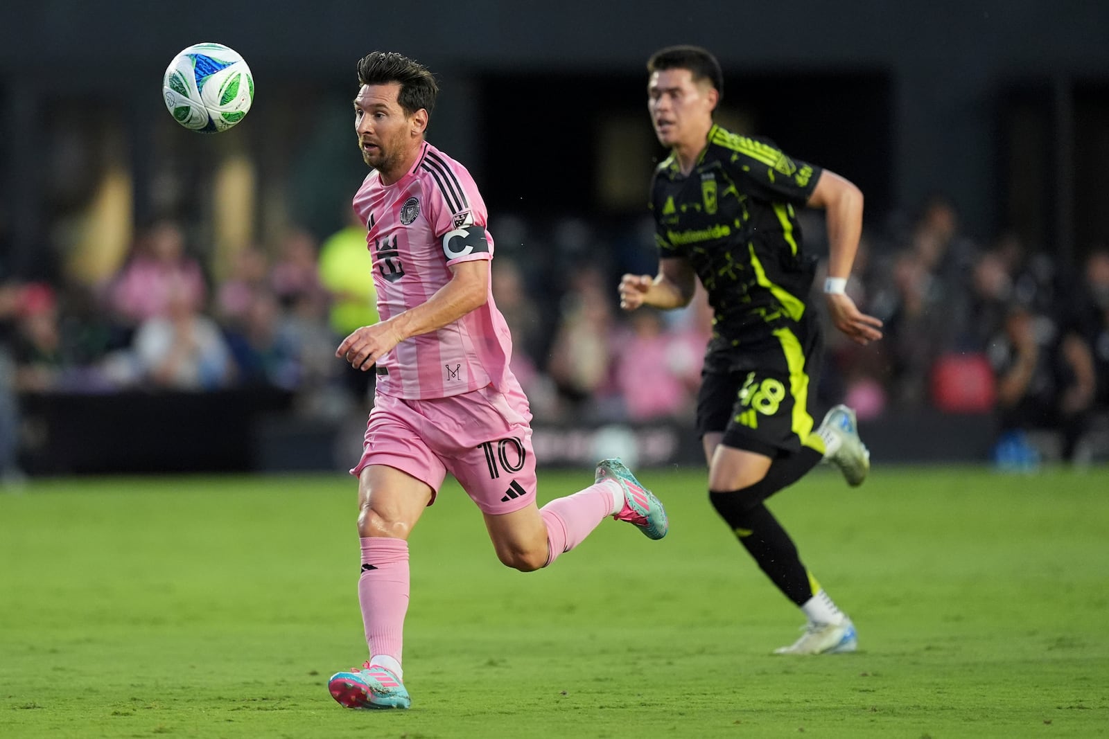 Inter Miami forward Lionel Messi (10) chases down a pass pursued by Columbus Crew defender Cesar Ruvalcaba (48) during the first half of an MLS soccer match, Saturday, May 31, 2025, in Fort Lauderdale, Fla. (AP Photo/Rebecca Blackwell)