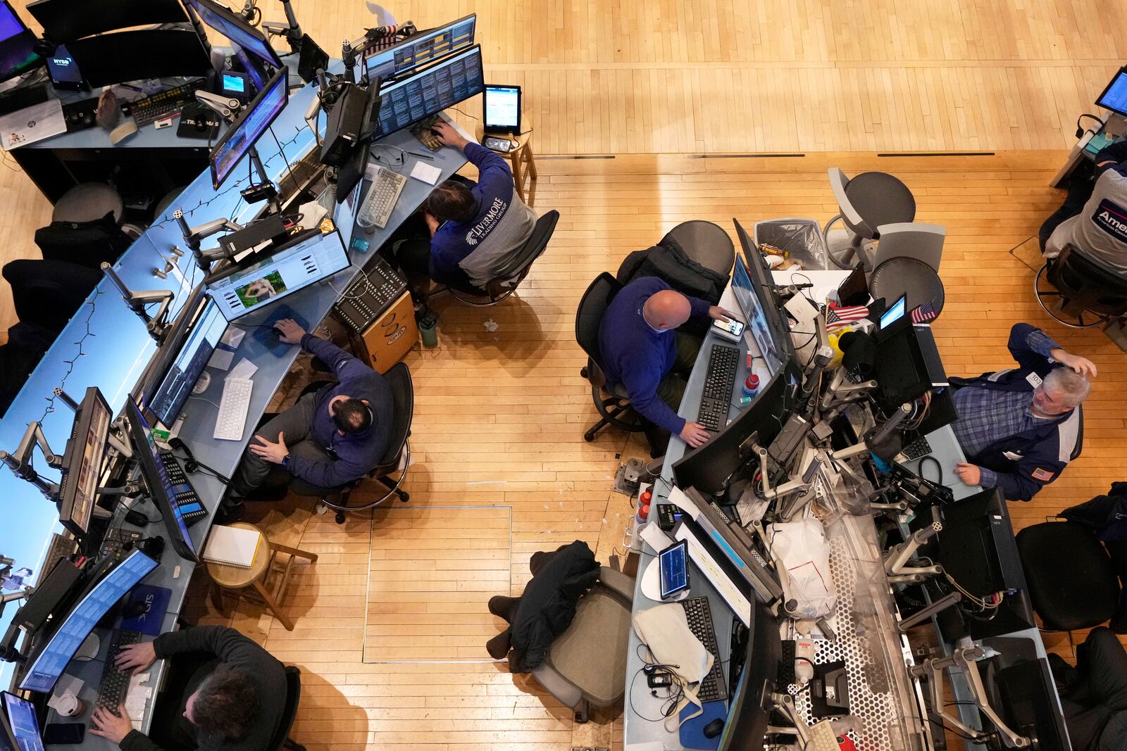 Traders work on the floor of the New York Stock Exchange, Thursday, April 10, 2025. (AP Photo/Richard Drew)