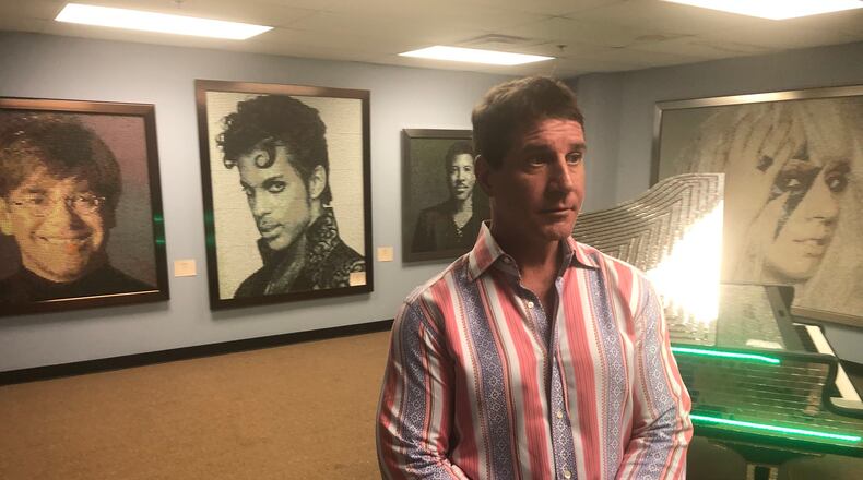 Masque owner Luke Liakos showed off his artwork as part of Downtown Dayton Partnership's  First Friday in August.  The artwork was displayed above the club opened at 34 N. Jefferson in 2004. Liakos announced in December that he will close the club Jan. 25 and is looking for a new location.