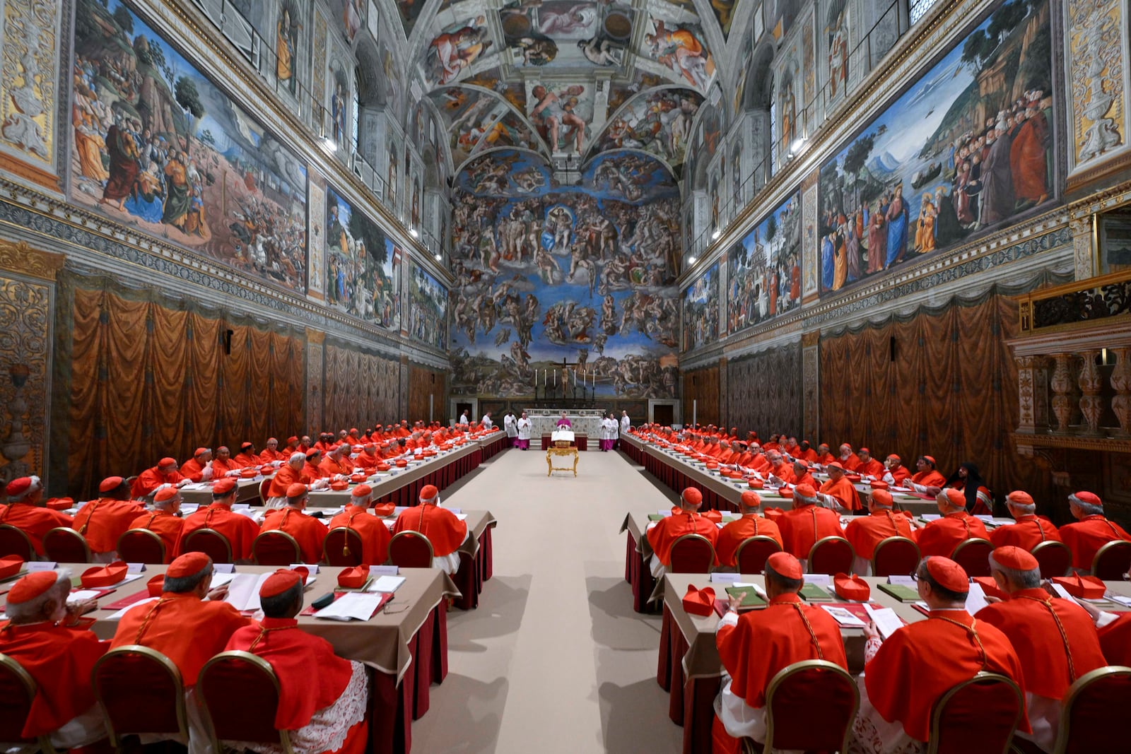 Cardinals attend the first day of the conclave to elect the successor of late Pope Francis inside the Sistine Chapel at the Vatican, Wednesday, May 7, 2025. (Vatican Media via AP)