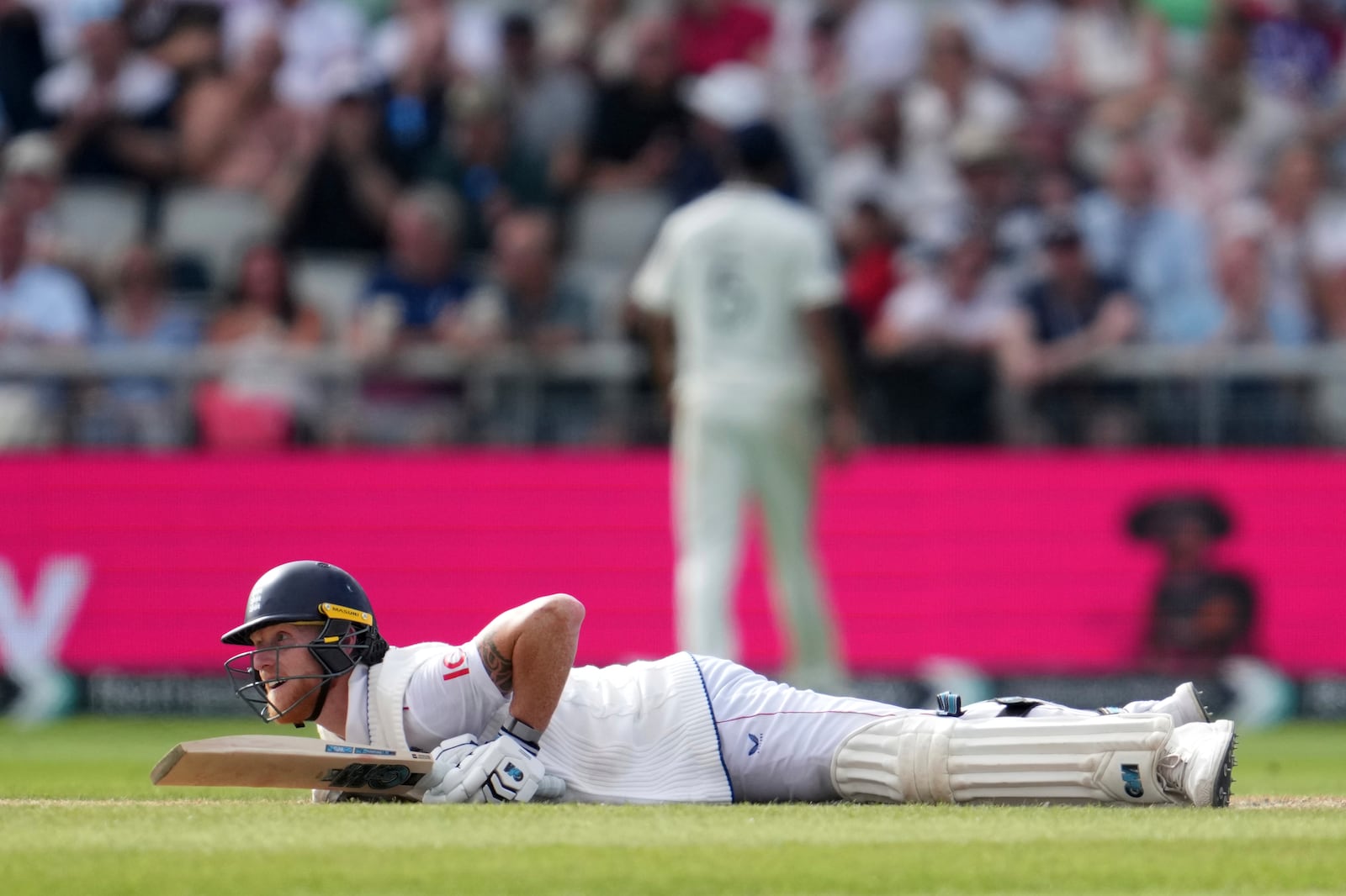 England's captain Ben Stokes loose his balance while playing a shot on the third day of the fourth cricket test match between England and India at Emirates Old Trafford, Manchester, England, Friday, July 25, 2025. (AP Photo/Jon Super)