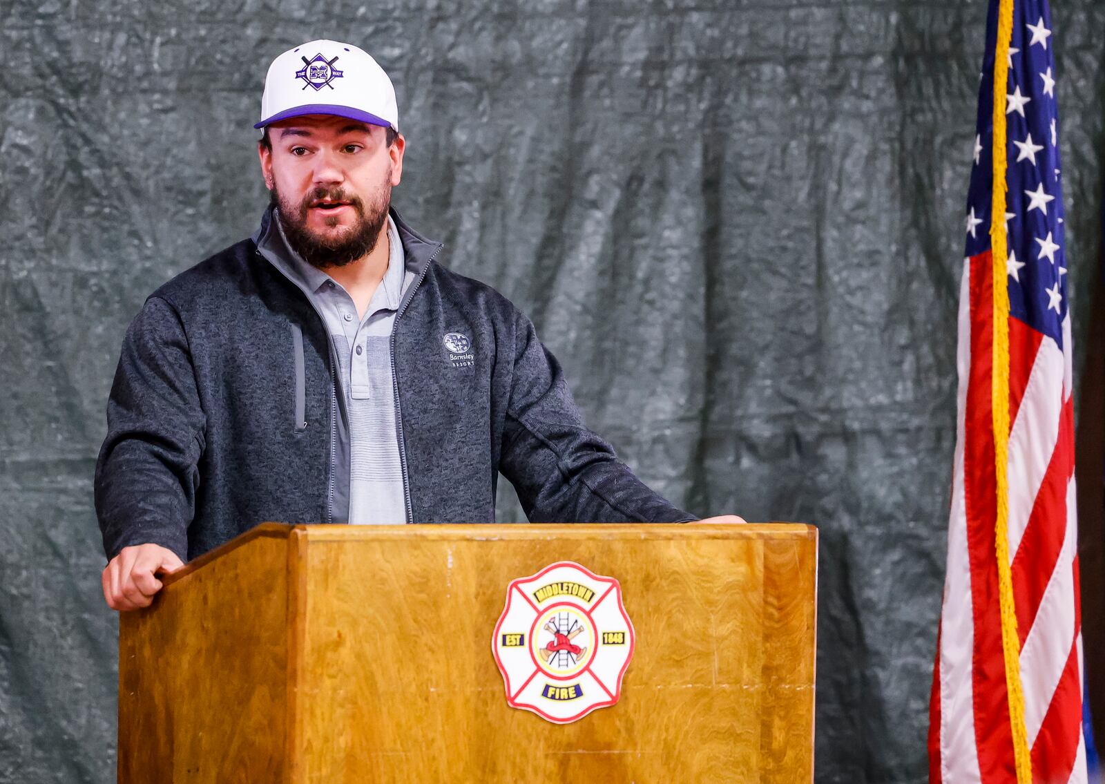 Kyle Schwarber, Middletown native and Major League Baseball player, speaks to the crowd before The Middletown Firefighters Association made a donation of over $16,000 to The Middie Way Baseball, an organization focused on helping area youth learn the game of baseball, during a ceremony Wednesday, Nov. 3, 2021 at the Middletown Division of Fire headquarters. NICK GRAHAM / STAFF