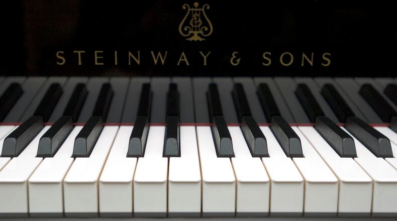 A Steinway & Sons piano is displayed at Steinway Hall, the manufacturer's showroom in New York, on Monday, June 21, 2004. Steinway & Sons is a unit of Waltham, Massachusetts-based Steinway Musical Instruments Inc. and has been manufacturing pianos in New York since 1853. Photographer: Daniel Acker/Bloomberg News