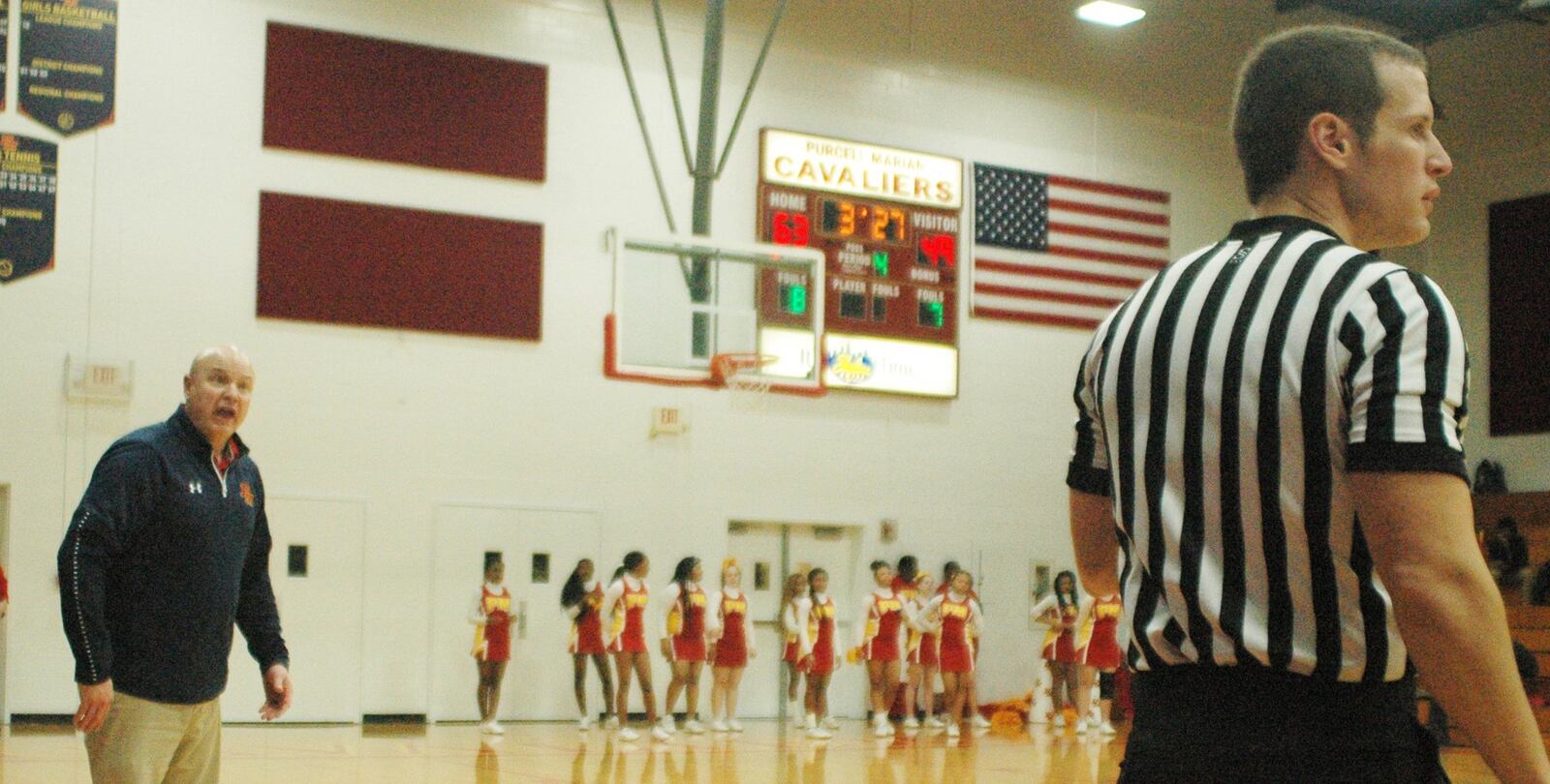 Purcell Marian coach Scott Kerr questions an official’s call during Friday night’s game against visiting Badin at the Eveslage Athletic Center. Purcell won 74-60. RICK CASSANO/STAFF