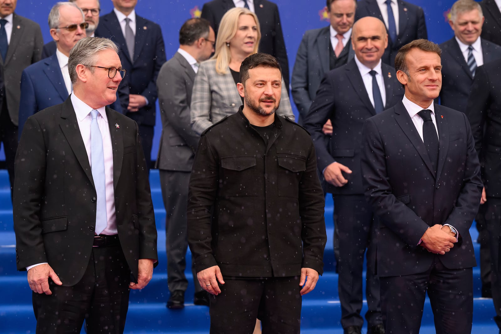 Britain's Prime Minister Keir Starmer, left, Ukraine's President Volodymyr Zelenskyy and France's President Emmanuel Macron, right, during a group photo at the beginning of a summit where the leaders of 47 European countries and organizations will discuss security, defense and democratic standards, in Tirana, Albania, Friday, May 16, 2025. (Leon Neal/Pool via AP)