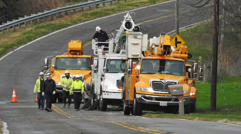Crews repair a utility pole at the scene of a fatal car crash at Tylersville Road and Mourning Dove on Wed., Nov. 17, 2021.