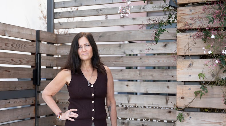 Jennifer Loving, CEO of Destination: Home, poses for a portrait outside of her office and housing units, Monday, Feb. 23, 2026, in San Jose, Calif. (AP Photo/Laure Andrillon)