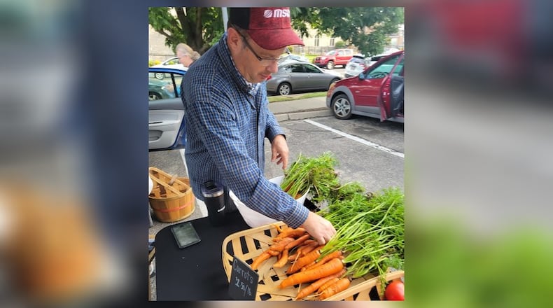 Greg Hamm has larger carrots for sale at the 2023 Oxford Farmers Market. CONTRIBUTED