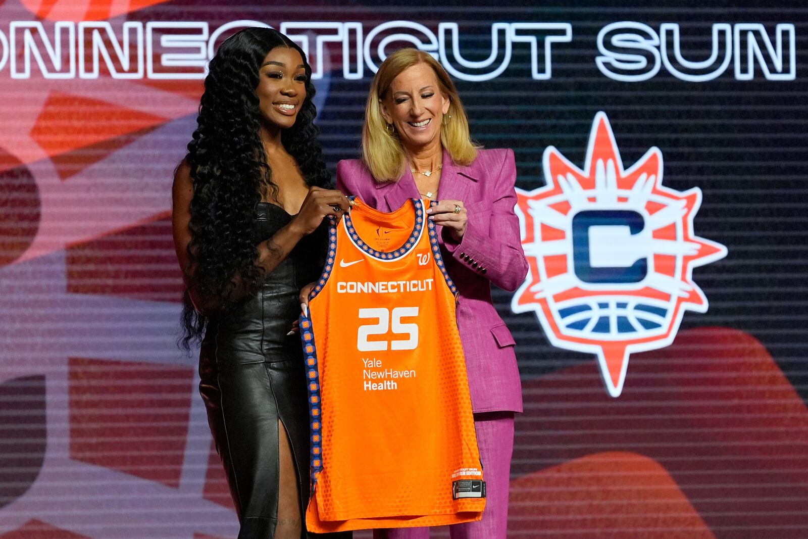 LSU's Aneesah Morrow, left, poses with WNBA commissioner Cathy Engelbert after being selected seventh overall by the Connecticut Sun during the first round of the WNBA basketball draft, Monday, April 14, 2025, in New York. (AP Photo/Pamela Smith)