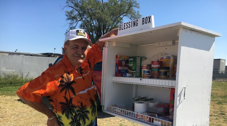 William Brown with the Blessing Box he built and installed in Hamilton. MIKE RUTLEDGE/STAFF