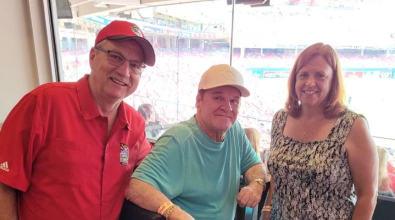 Rick McCrabb and his wife, Tammy, spent time with Cincinnati Reds legend Pete Rose during a 2021 game at Great American Ball Park. SUBMITTED PHOTO