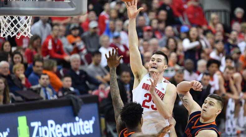 COLUMBUS, OH - DECEMBER 15: Kyle Young #25 of the Ohio State Buckeyes shoots over Bruce Moore #13 of the Bucknell Bisons and Nate Sestina #4 of the Bucknell Bisons in the second half on December 15, 2018 at Value City Arena in Columbus, Ohio. Ohio State defeated Bucknell 73-71. (Photo by Jamie Sabau/Getty Images)