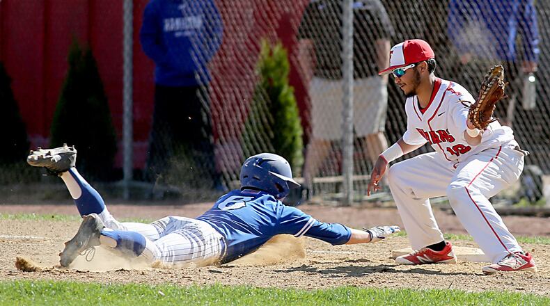 Hamilton’s Payton Pennington beats the pickoff attempt of Fairfield first baseman Trinidad Selvie during Sunday’s game at Joe Nuxhall Field in Fairfield. CONTRIBUTED PHOTO BY E.L. HUBBARD