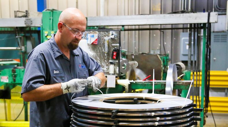 In this September 2017 file photo, Darin Viel packed stainless steel coils at United Performance Metals in Hamilton. GREG LYNCH / STAFF