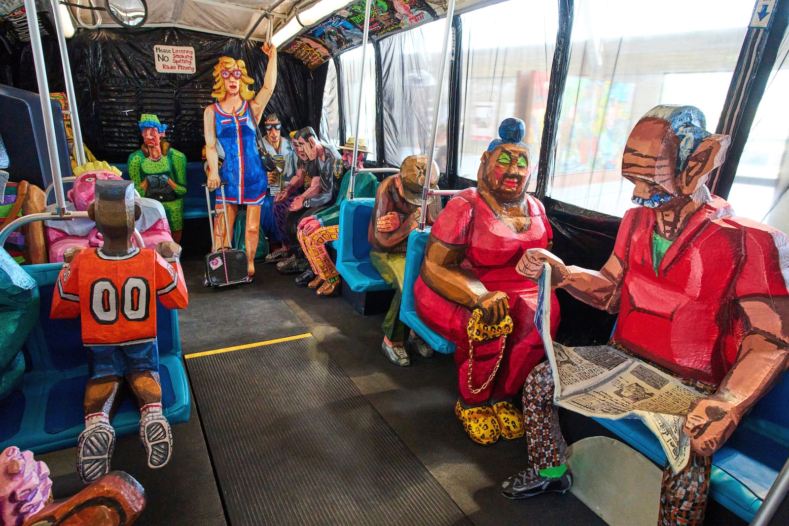 Interior view of The Bus by Red Grooms during a press preview at the Fenix Migration Museum in Rotterdam, Netherlands, Wednesday, May 14, 2025. (AP Photo/Peter Dejong)