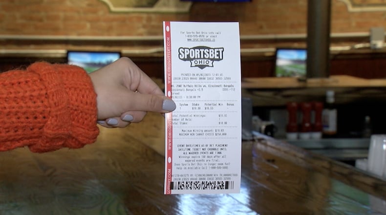 A sports bet is placed at a bar in Cincinnati after it was legalized Jan. 1, 2023. MADELINE OTTILIE/WCPO