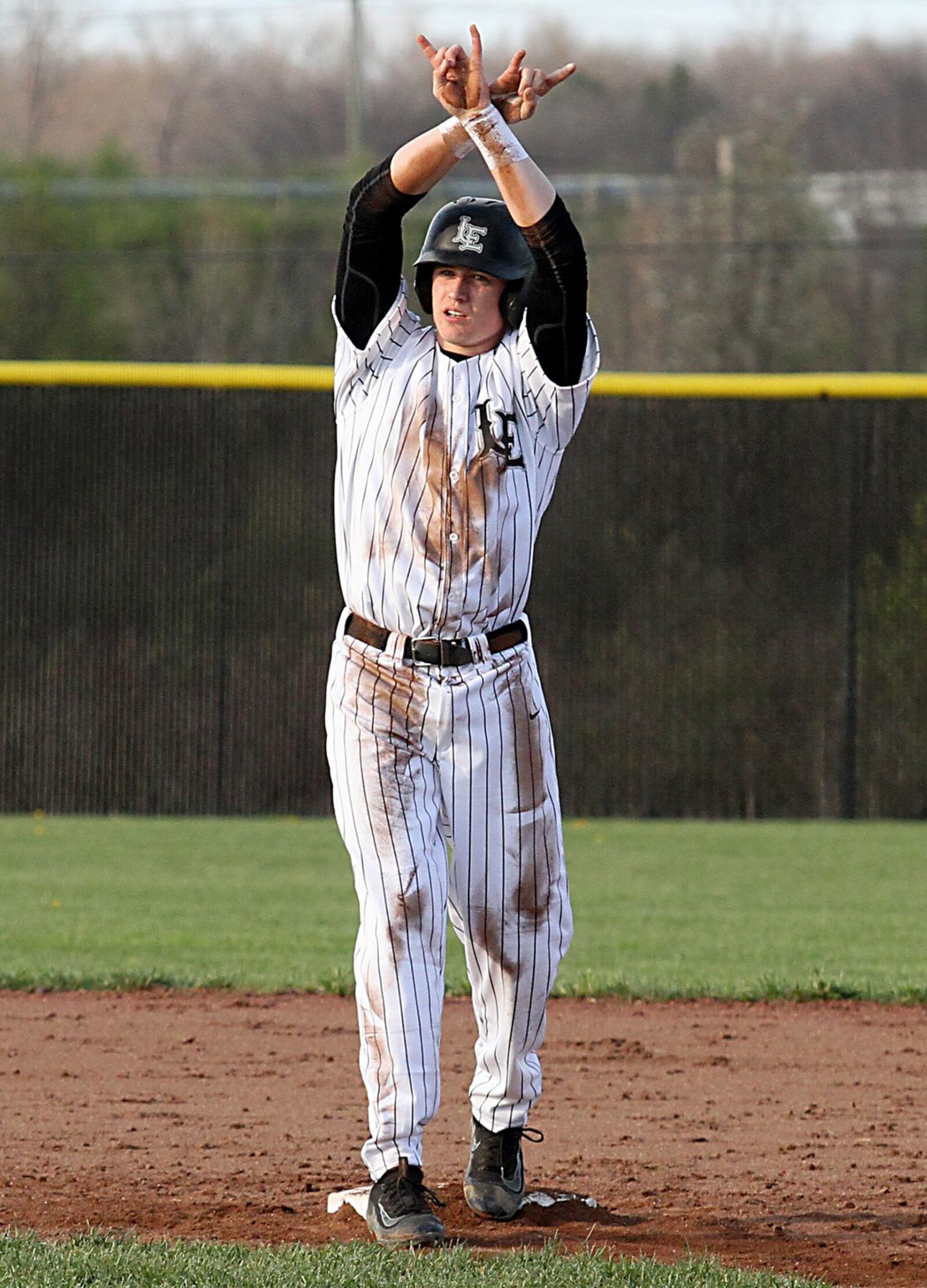 Lakota East’s Joseph Cooney reacts to his RBI double in the fifth inning of Tuesday’s game against visiting Oak Hills. CONTRIBUTED PHOTO BY E.L. HUBBARD