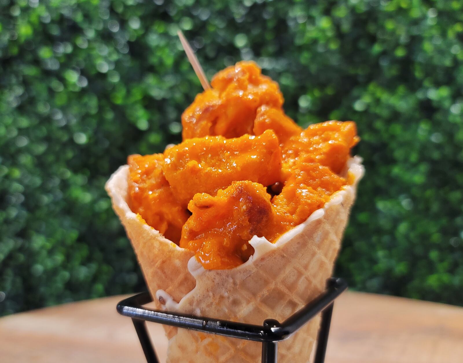 Chick'nCone restaurant has opened at The Marcum in Hamilton. The restaurant features air fried chicken chunks with multiple sauces served in fresh made waffle cones. NICK GRAHAM / STAFF