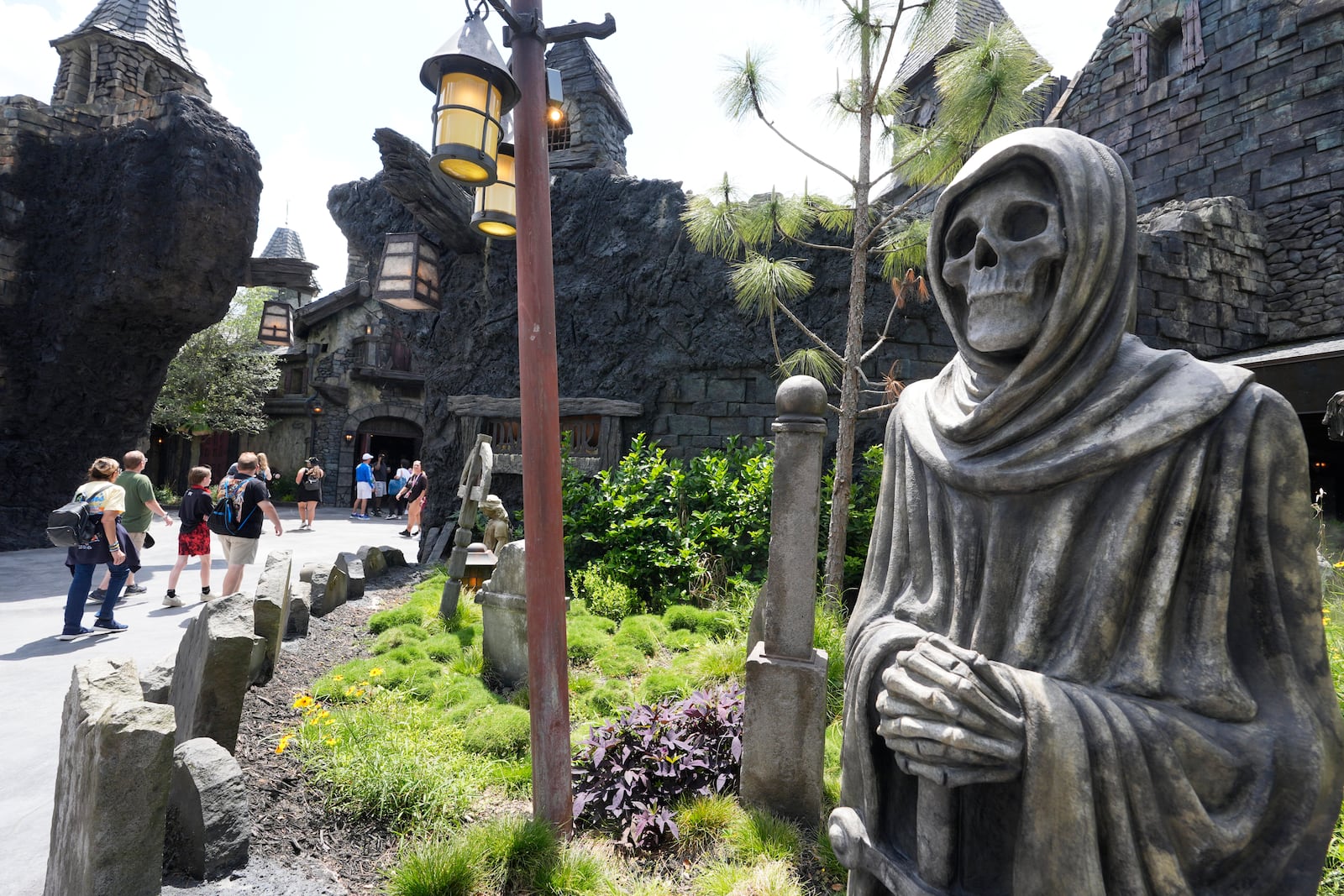 Guests tour the Dark Universe at Epic Universe Theme Park at Universal Resort Orlando Thursday, April 10, 2025, in Orlando, Fla. (AP Photo/John Raoux)
