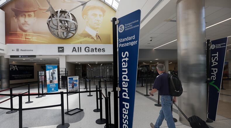 Travelers walk through Dayton International Airport Thursday, June 27, 2024. The airport will be busy for Independence Day week as travel nationwide is expected to be 5% greater than in 2023 and 8% greater than 2019. MARSHALL GORBY/STAFF