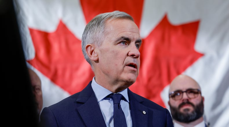 Prime Minister Mark Carney meets with ironworkers in Calgary, Alta., Thursday, Nov. 27, 2025. (Jeff McIntosh /The Canadian Press via AP)