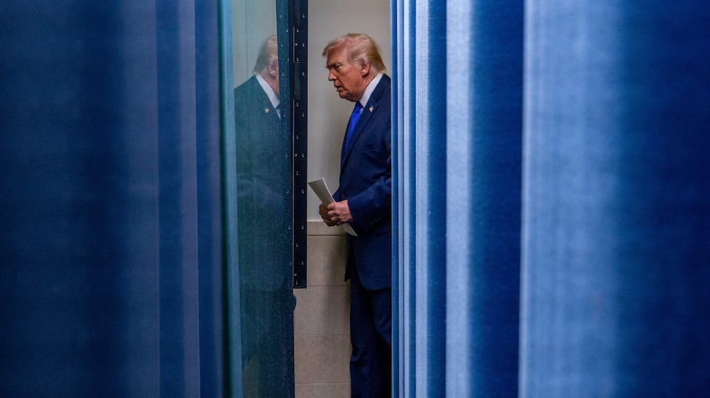 President Donald Trump arrives to speak with reporters in the James Brady Press Briefing Room at the White House, Friday, Feb. 20, 2026, in Washington. (AP Photo/Alex Brandon)