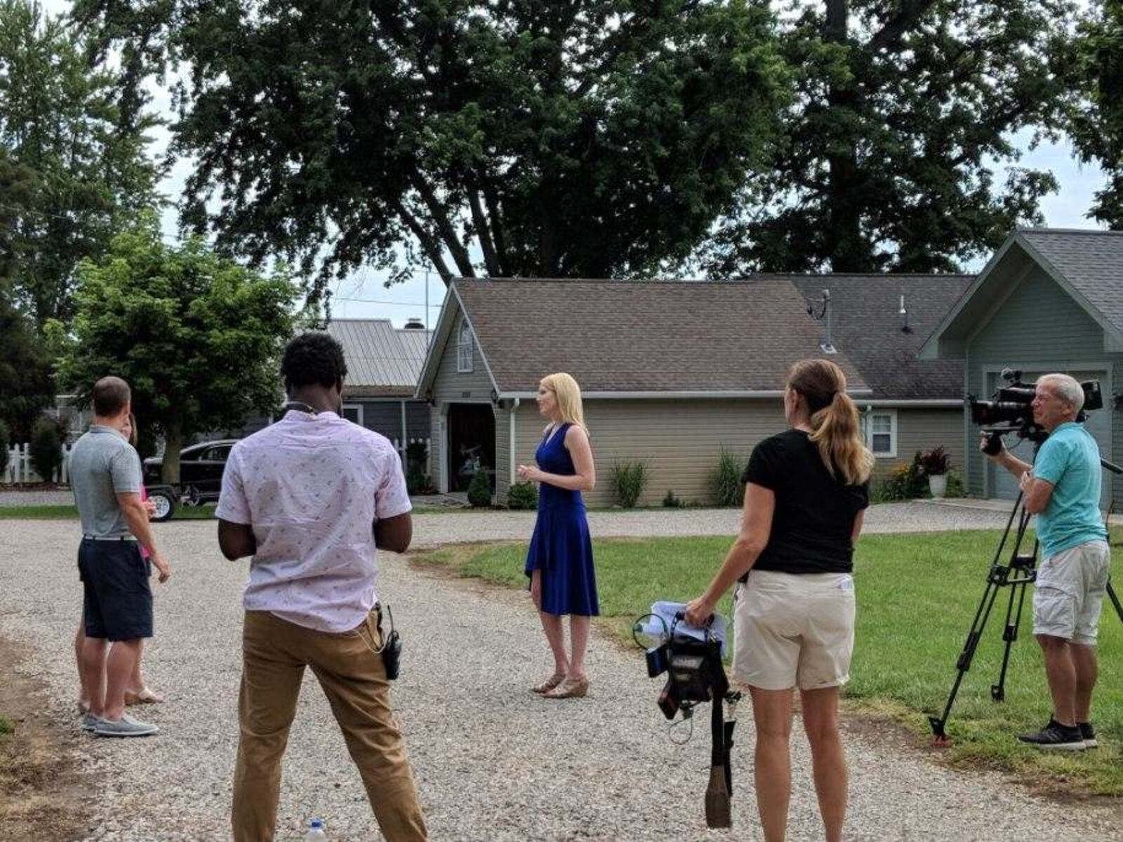 Indian Lake realtor Paige Duff (blue dress) is pictured with Dayton area residents Chris and Tina Gibbs and members the crew of HGTV's "Island Life."