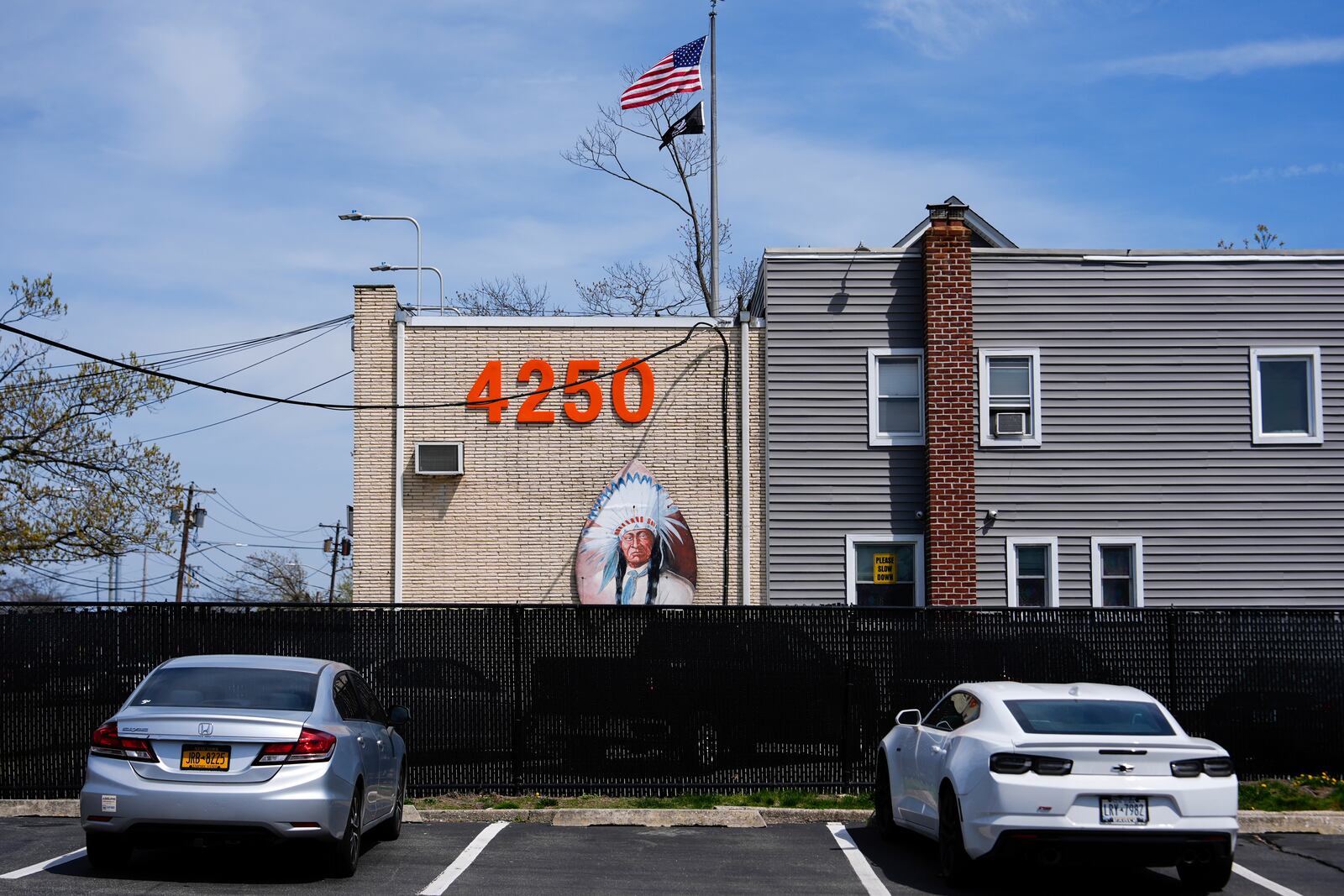 An image of an Indian adorns the facade of the Big Chief Lewis Building, in Massapequa, N.Y., Friday, April 25, 2025. (AP Photo/Julia Demaree Nikhinson)