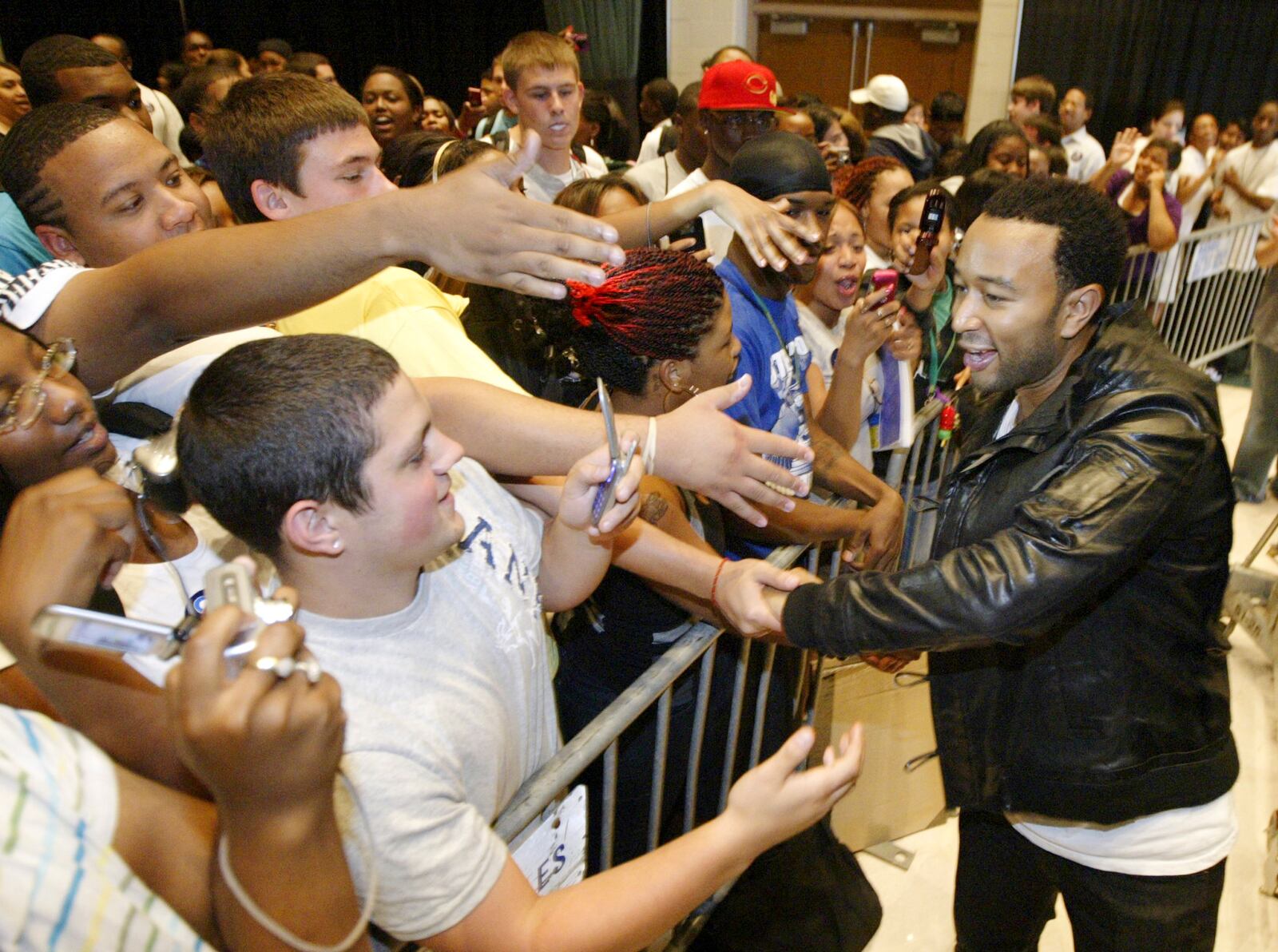 Grammy-winning singer John Legend greets fans after performing  Sept. 29, 2012 at Wright State University as part of Sen. Barack Obama's campaign to encourage voters to cast their ballots early. Staff photo by Chris Stewart