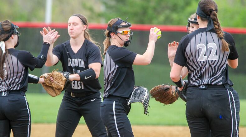 Lakota East pitcher Sydney Larson (with ball) celebrates with teammates during their game at Lakota West on Tuesday. GREG LYNCH/STAFF