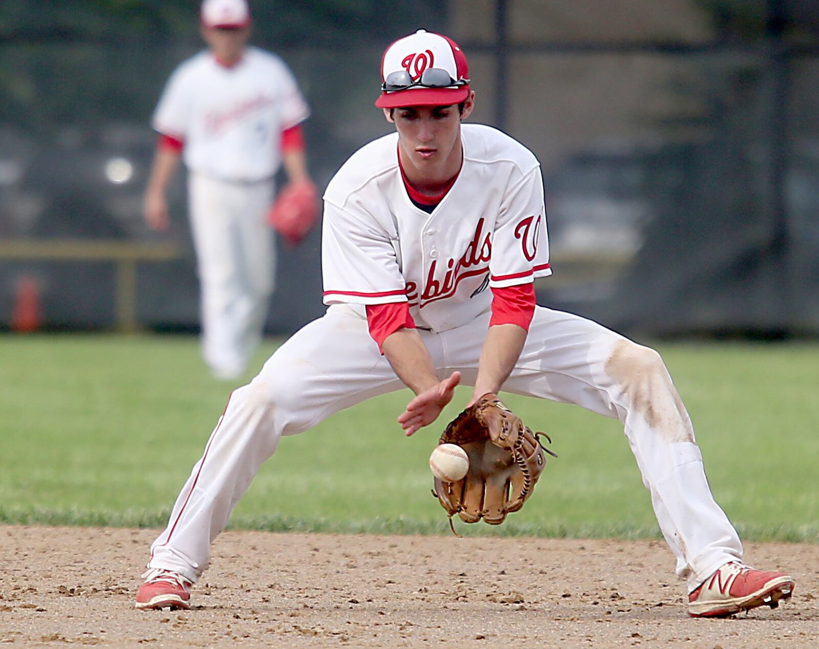 Lakota West second baseman Frankie Schmitt fields a Springboro ground ball during a Division I district final against Springboro on Saturday at Centerville. CONTRIBUTED PHOTO BY E.L. HUBBARD