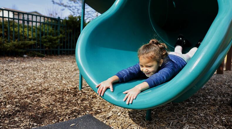 Micah Adams-Jones, 3, plays on the playground at Village Green Park on Tuesday, March 21, 2023, in Fairfield. Fairfield is planning an upgrade to its play area at Village Green Park, which includes taking down at least one dead tree, expanding the area, and replacing the outdated play equipment. They'll also be taking down the underused gazebos and may reuse them at another city property. NICK GRAHAM/STAFF