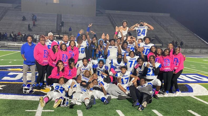 The Dunbar football team poses for a photo in 2022.