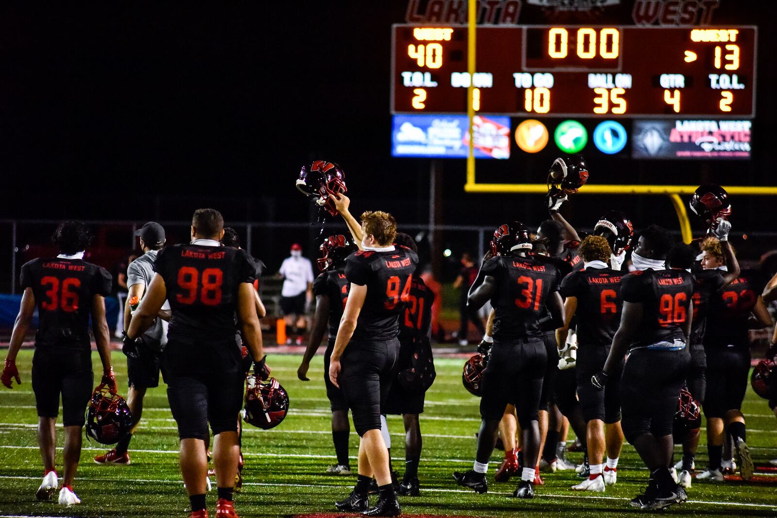 Lakota West football team salutes Hamilton with their helmets up after their game Friday, Sept. 4, 2020 at Lakota West High School in West Chester Township. Lakota West won 40-13. NICK GRAHAM / STAFF