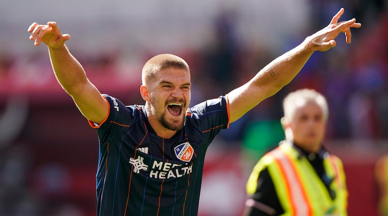 FC Cincinnati defender Nick Hagglund celebrates after defeating the New York Red Bulls during an MLS soccer playoff match, Saturday, October 15, 2022, in Harrison, N.J. FC Cincinnati won 2-1.(AP Photo/Eduardo Munoz Alvarez)