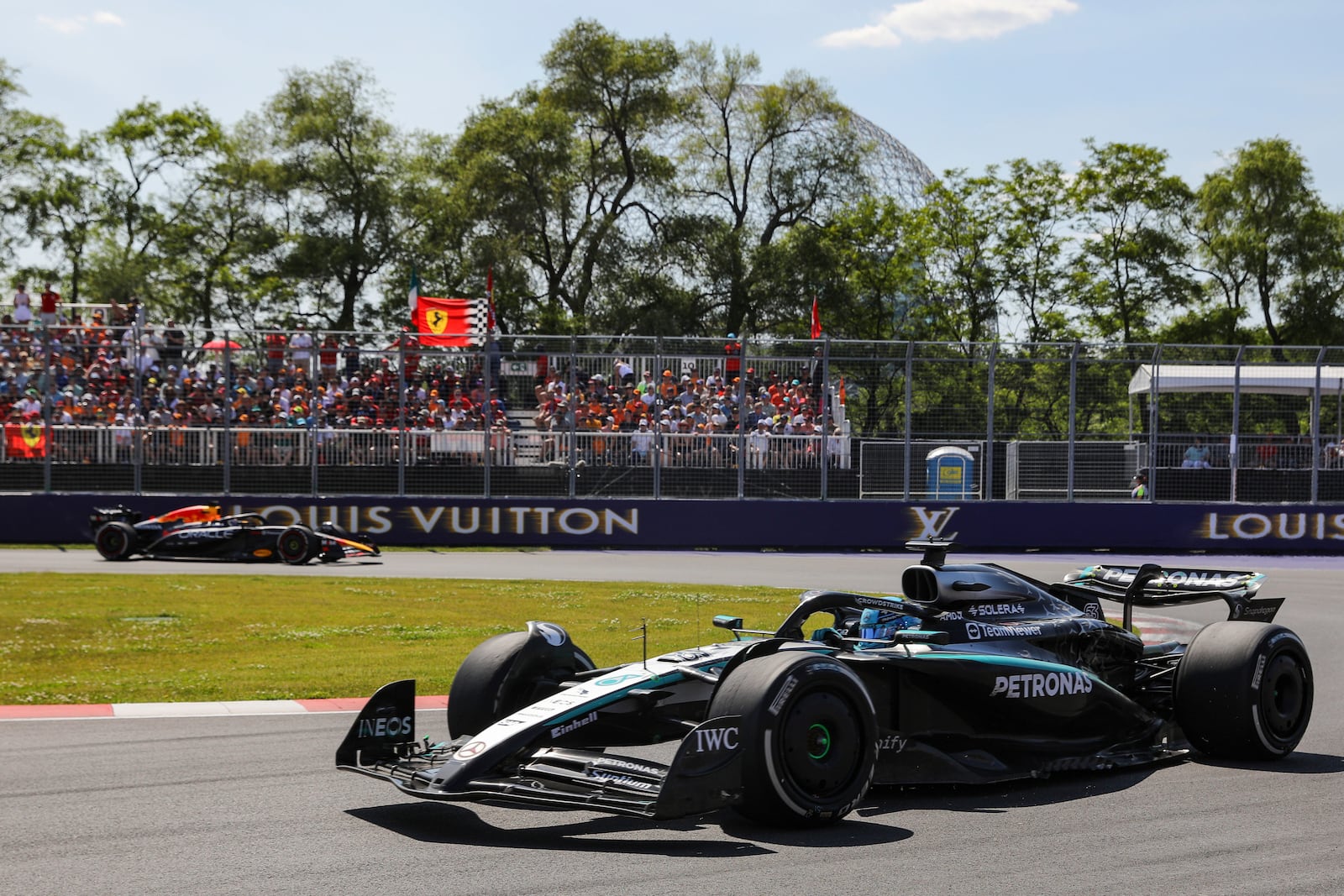 Mercedes driver George Russell, of the United Kingdom, leads Red Bull Racing driver Max Verstappen, of the Netherlands, through the hairpin during Formula One auto racing action at the Canadian Grand Prix, in Montreal on Sunday, June 15, 2025. (Evan Buhler/The Canadian Press via AP)