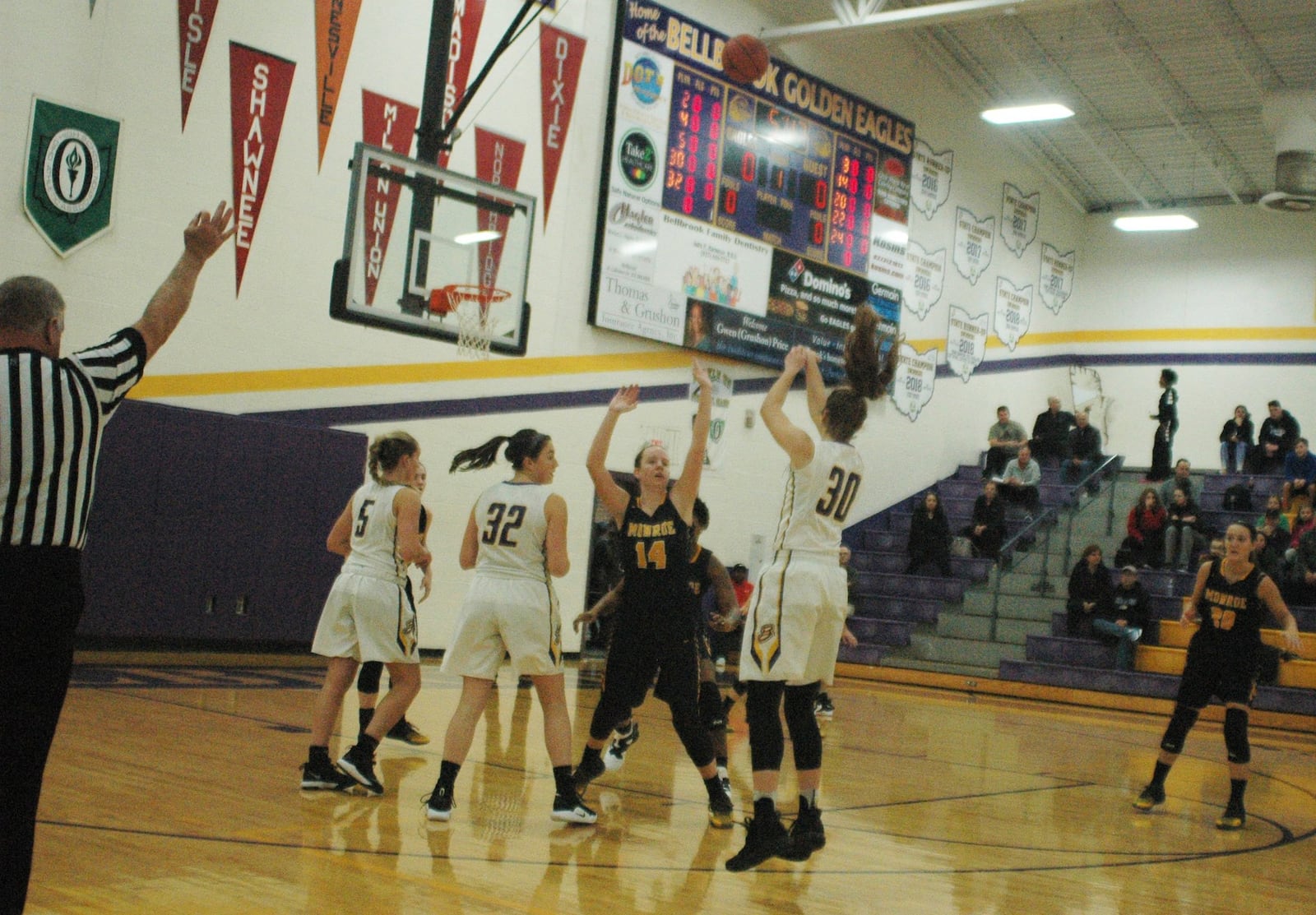 Bellbrook’s Kayla Paul (30) launches a 3-point attempt over Monroe’s Sophie Sloneker (14) during Monday night’s game at Bellbrook. Monroe won 31-29. RICK CASSANO/STAFF