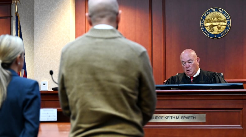 Justin Daniel Dennis (foreground) and his his attorney, Chelsea Panzeca, listen to Butler County Common Pleas Judge Keith Spaeth during a court appearance on Thursday, Oct. 16, 2025. Dennis, 42, is charged with eight counts of sexual battery, all third-degree felonies. The former Lakota teacher allegedly had an inappropriate relationship with a student when she was 17 during the 2021-2022 school year. Spaeth set a jury trial for Feb. 2, 2026. MICHAEL D. PITMAN/STAFF