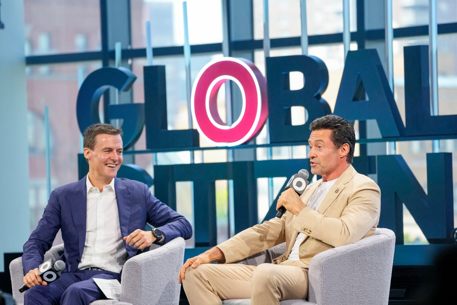 FILE - Actor and Global Citizen Ambassador Hugh Jackman, right, is joined by Global Citizen CEO and Co-Founder Hugh Evans as he addresses attendees of the Global Citizen Now conference, May 2, 2024, in New York. (AP Photo/Mary Altaffer, file)