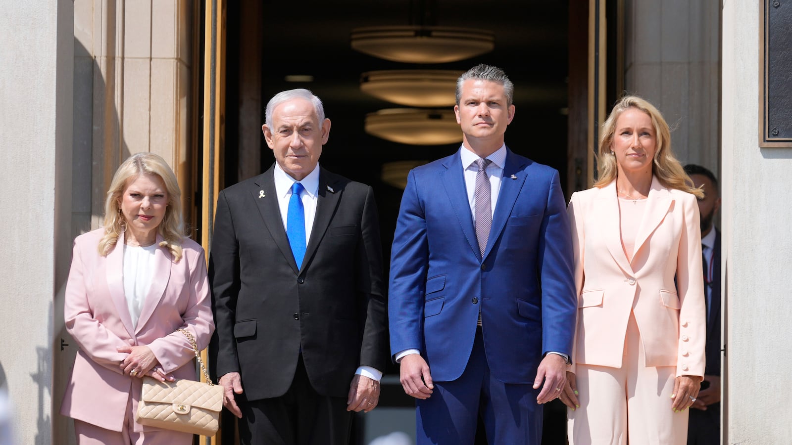 Israeli Prime Minister Benjamin Netanyahu and his wife Sara stand with Secretary of Defense Pete Hegseth and his wife Jennifer during an honor cordon ceremony upon his arrival at the Pentagon, Wednesday, July 9, 2025, in Washington. (AP Photo/Mark Schiefelbein)