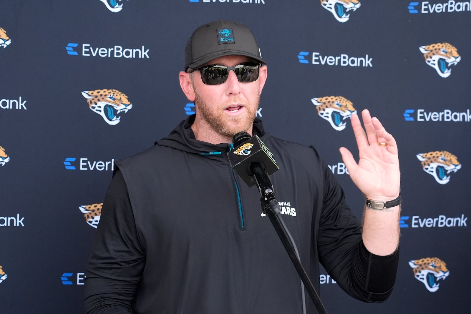 Jacksonville Jaguars head coach Liam Coen talks with reporters after practice at the team's NFL football training camp, Wednesday, July 23, 2025, in Jacksonville, Fla. (AP Photo/John Raoux)