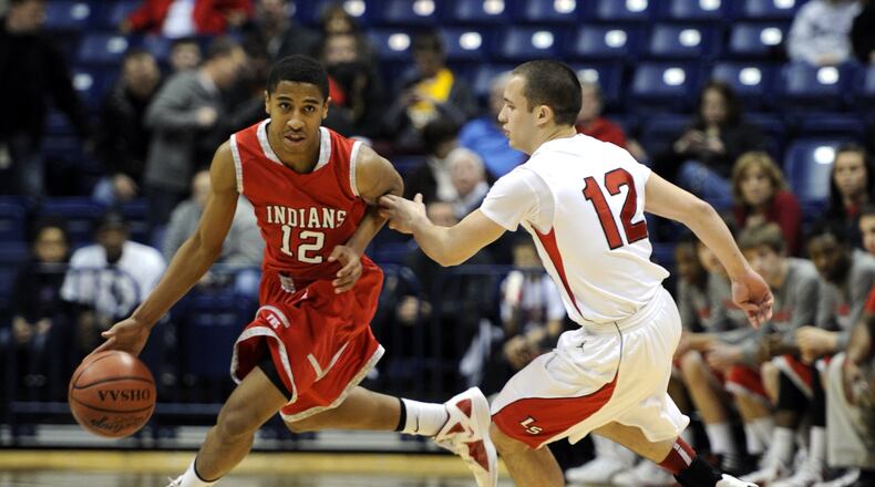 Fairfield’s Tim Fleming dribbles around La Salle’s Chris Rodriguez during their Division I sectional game against Xavier University’s Cintas Center on March 3, 2012. The Indians won 35-30. JOURNAL-NEWS FILE PHOTO