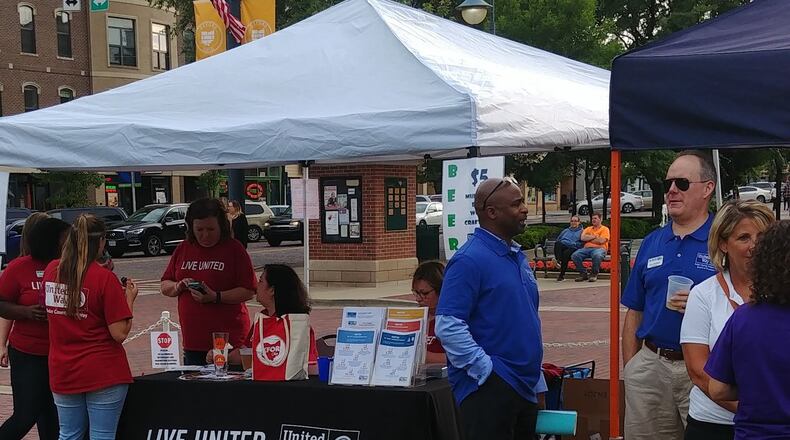 Butler County United Way staff and volunteers were in Oxford June 26 for the kickoff Uptown to meet local residents and talk about the organization into which the United Way of Oxford, Ohio and Vicinity merged Feb. 1. CONTRIBUTED/BOB RATTERMAN