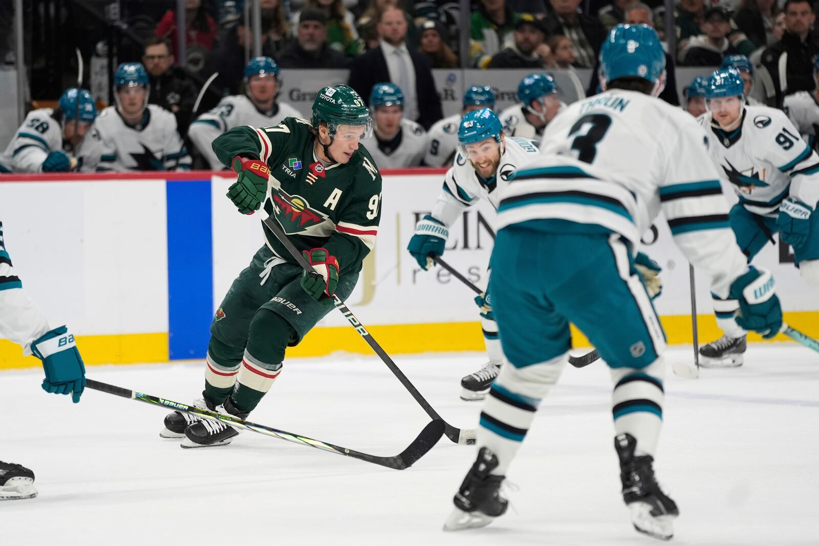 Minnesota Wild left wing Kirill Kaprizov (97) skates with the puck during the first period of an NHL hockey game against the San Jose Sharks, Wednesday, April 9, 2025, in St. Paul, Minn. (AP Photo/Abbie Parr)