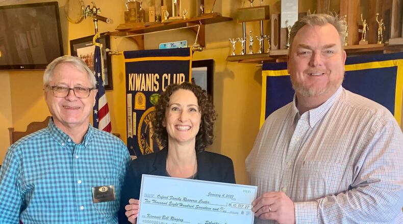 The successful local Salvation Army bell ringing effort resulted in a donation of $10,817.27 to the Family Resource Center. The check was presented at a Kiwanis Club noon luncheon by (from left) David Belka, Kiwanis bell ringing coordinator, and Jennifer Marston, Kiwanis president, to Brad Hoblitzell, FRC executive director. CONTRIBUTED