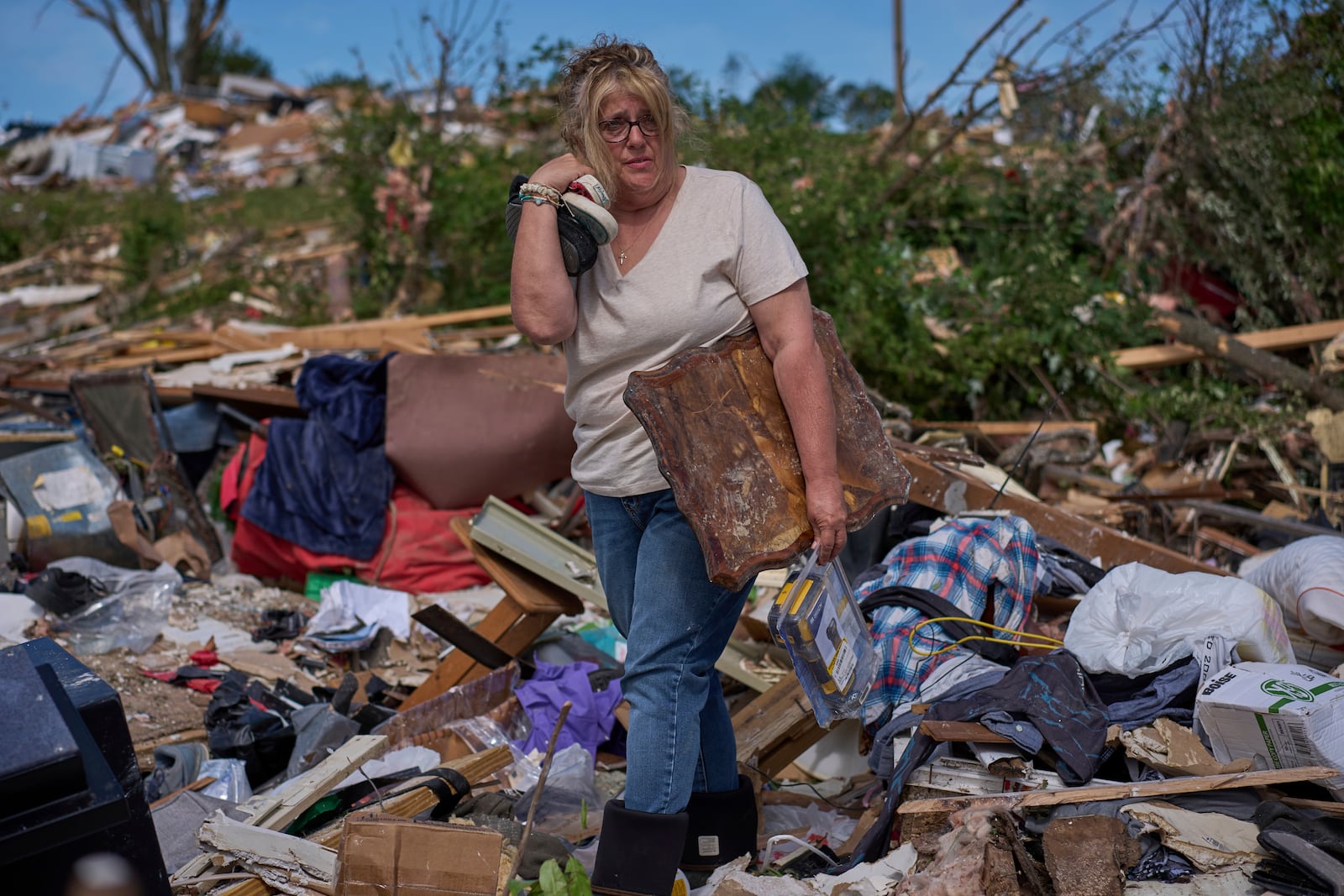 Edwina Wilson stands in what is left of her destroyed home, Sunday, May 18, 2025, in London, Ky., after a severe storm passed through the area. (AP Photo/Carolyn Kaster)