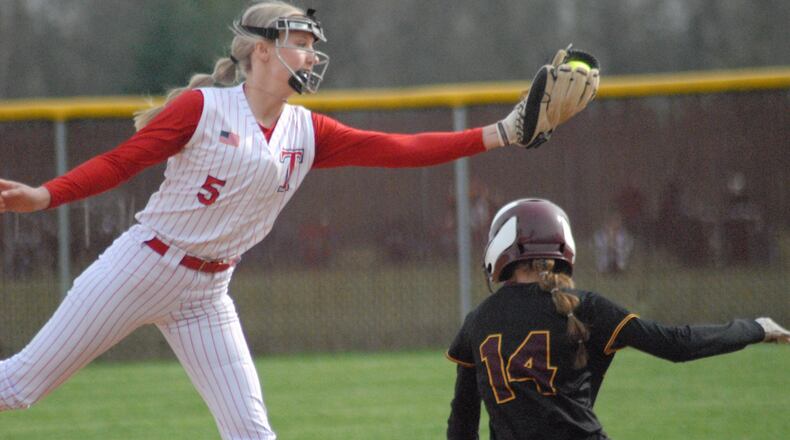 Talawanda junior shortstop McKenna Weekley receives a throw from the plate as Ross freshman base runner Liv Powers slides in safely for the steal on Friday. Chris Vogt/CONTRIBUTED