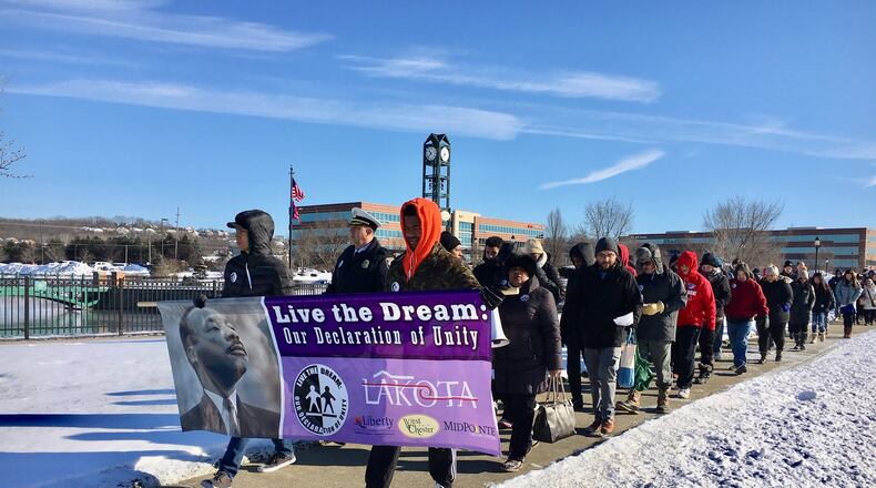 Marchers celebrating Martin Luther King Jr. Day in Butler County’s West Chester Township braved single-digit cold during their trek from the township’s main square to nearby Lakota West High School. The crowd swelled at the high school to more than 300 as they gathered to hear speakers and honor students on the national holiday Monday.
