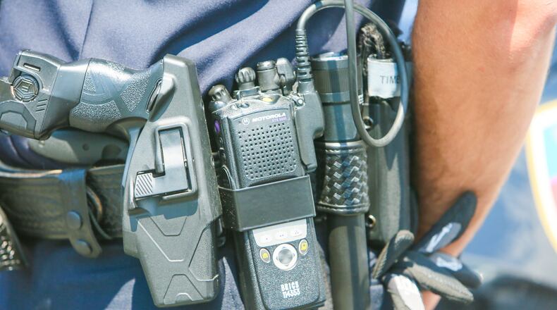 Many police and fire agencies across Butler County eschewed the county’s $10 million replacement contract with Motorola in favor of a wait and see approach. Several departments have been testing Kenwood radios as a cheaper alternative and now the fire chiefs are seeking a grant to cover the cost. ———————————————————————— Fairfield Police officer Scott Webb displays his radio outside the police station, Wednesday, Aug. 2, 2017. Butler County officials and police and fire departments across the county are looking at a $19.2 million price tag to replace parts of the 800 MHz communications systems, including the radios first responders carry.GREG LYNCH / STAFF