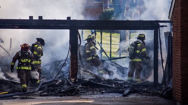 The Ohio House voted 74-22 last week to pass House Bill 308. The Ohio Senate is now debating the bill which would allow first responders to seek workers’ compensation benefits without having a physical injury that led to a post-traumatic stress disorder diagnosis. Only physical injuries, or mental injuries caused by a physical injury, are currently covered by the Ohio Bureau of Workers’ Compensation. Pictured are Middletown firefighters working to extinguish a garage fire in July 2019. NICK GRAHAM/FILE